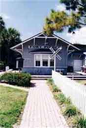 An old train station with a brick sidewalk
